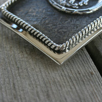 GABE CROSSHATCH BUCKLE WITH HORSESHOE AND BRONC